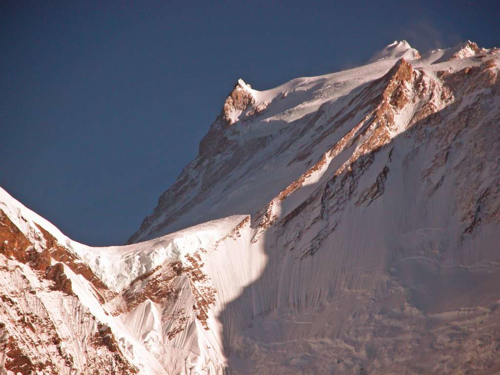 Manaslu 09 09 Manaslu From Bimtang Heres another closer view from Bimtang of the summit plateau of Manaslu with the East Pinnacle (7992m) on the left and the summit to the right.